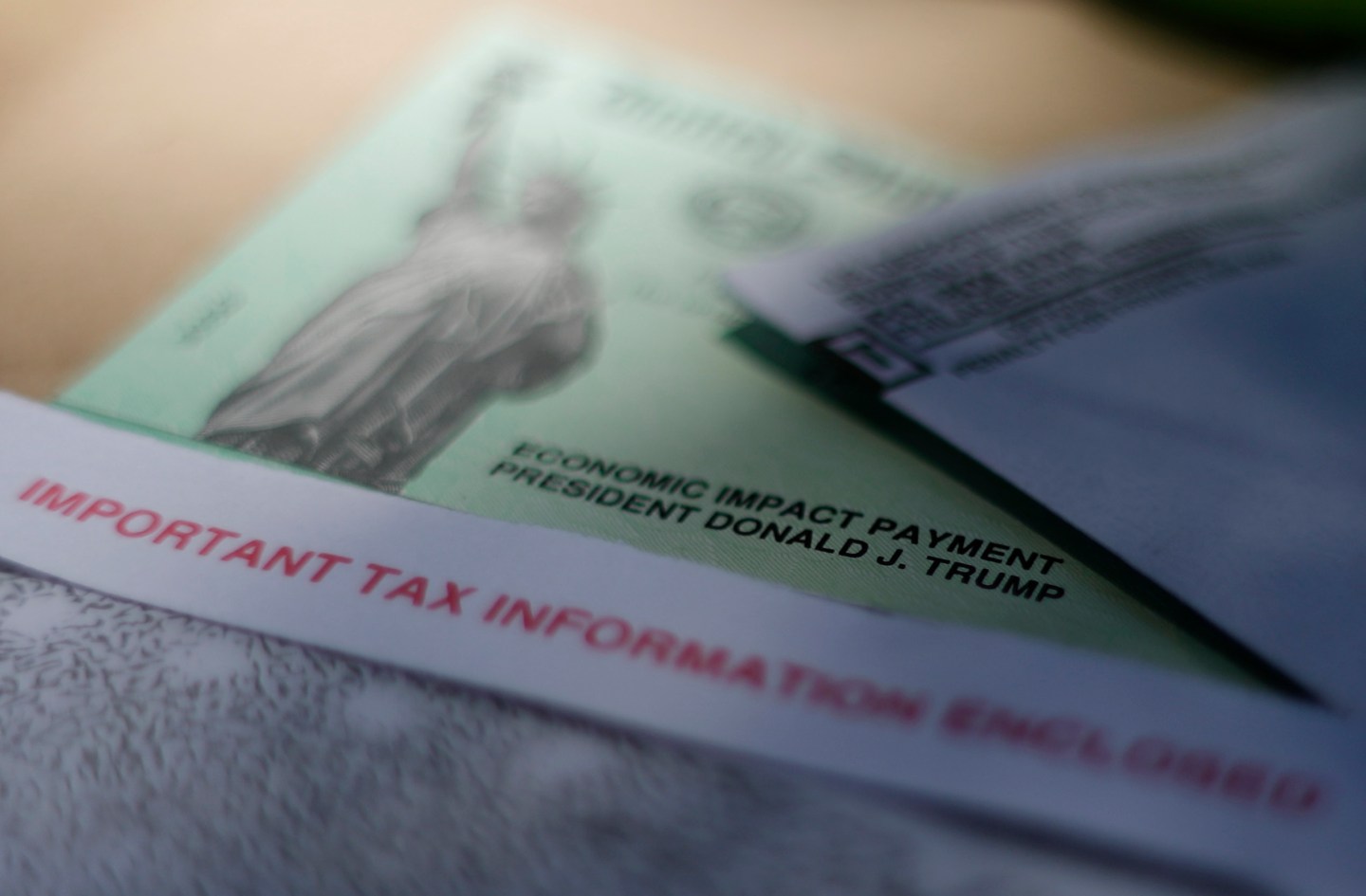 President Donald J. Trump's name is printed on a stimulus check issued by the IRS to help combat the adverse economic effects of the new coronavirus outbreak in San Antonio, April 23, 2020.