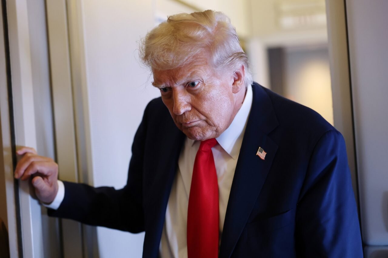 President Donald Trump speaks to reporters on Air Force One on September 18, 2025 during a flight to Joint Base Andrews, Maryland.