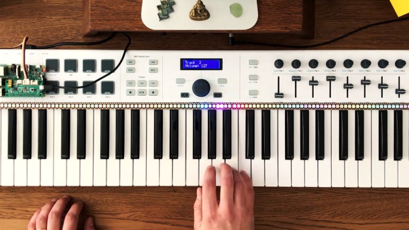 Stanislaw playing notes on his MIDI keyboard, with the LEDs on the LED strip lighting up right above the note he's playing, driven by the Raspberry Pi that runs a script based on the Pianolizer toolkit