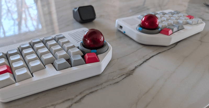 Levels, a split keyboard prototype with dual trackballs and 80s styling. 