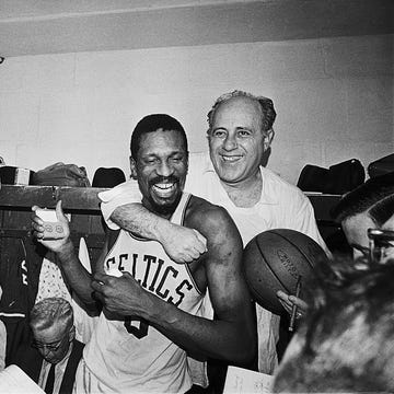Red Auerbach Hugging Bill Russell at Press Conference red auerbach hugging bill russell at press conference