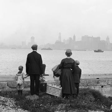 Immigrant Family Looking at New York Skyline immigrant family looking at new york skyline