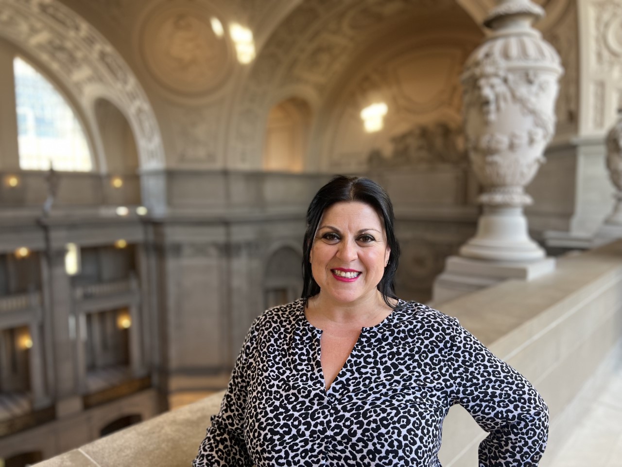 Martha Yanez at City Hall, wearing a black and white top and hair tied back