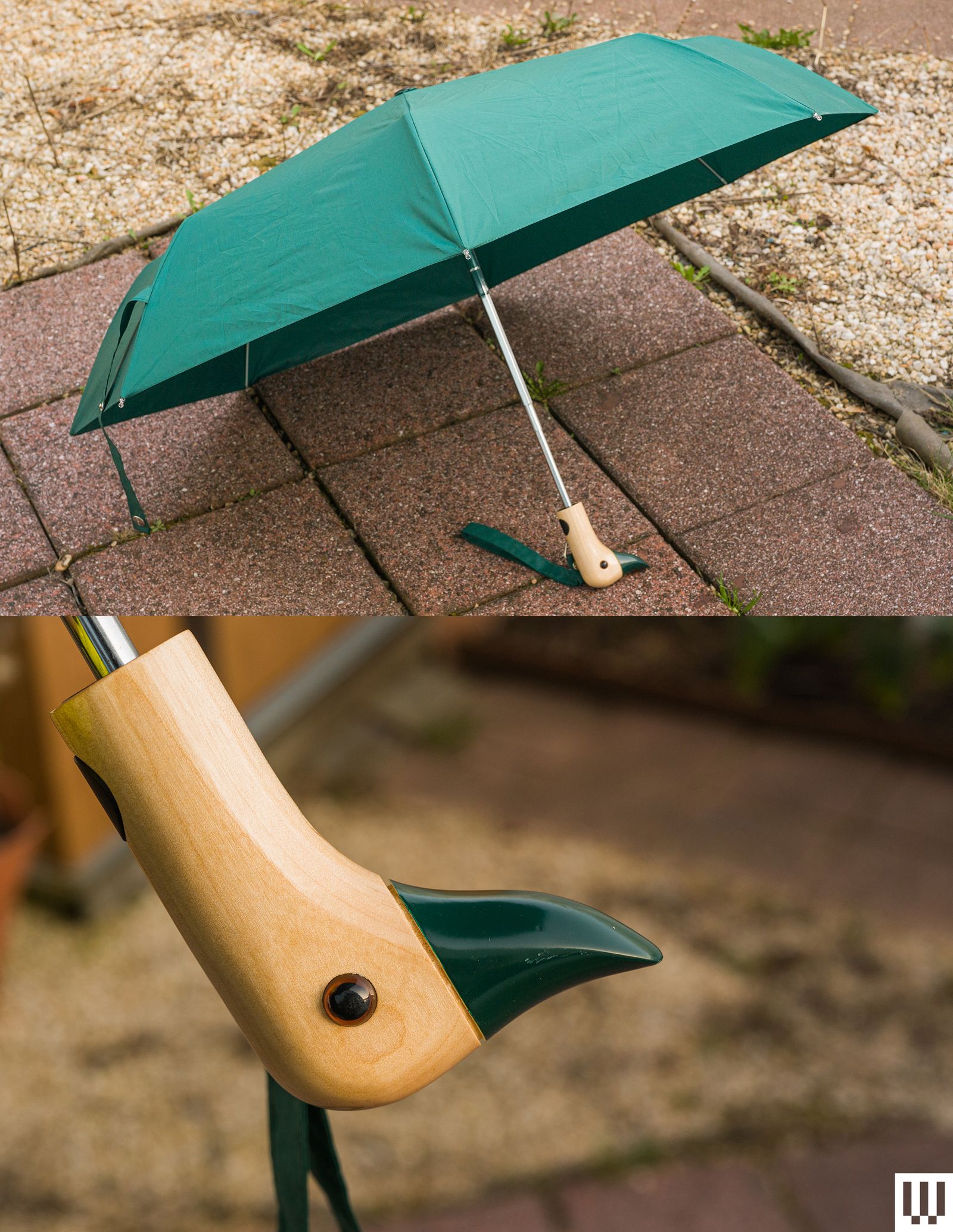 Original Duckhead Umbrella in green on paved sidewalk with patchy grass behind it