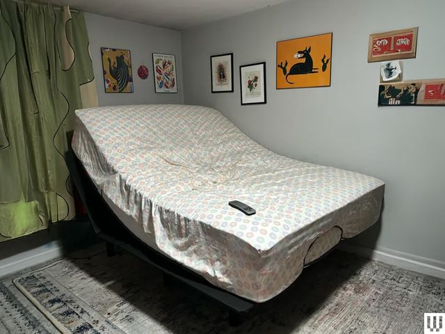 Image may contain Furniture Bed Electronics Mobile Phone Phone Art and Painting