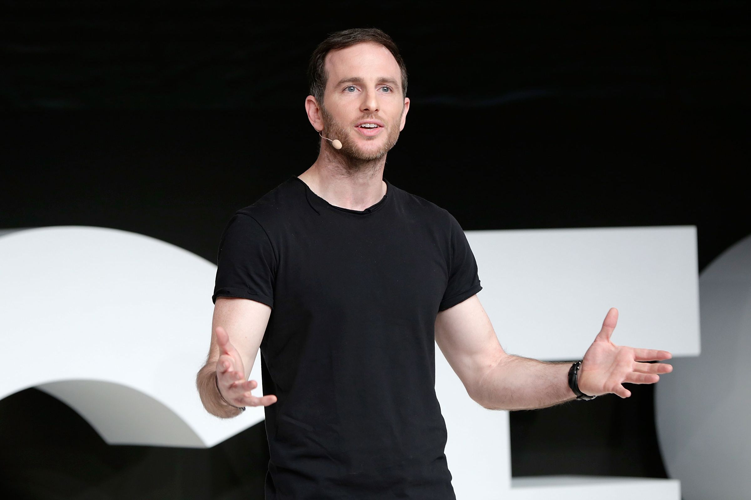 Image may contain Joe Gebbia Body Part Finger Hand Person Adult Clothing TShirt People and Performer