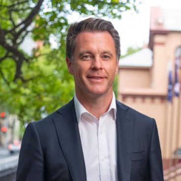 A headshot of NSW Premier Chris Minns outside