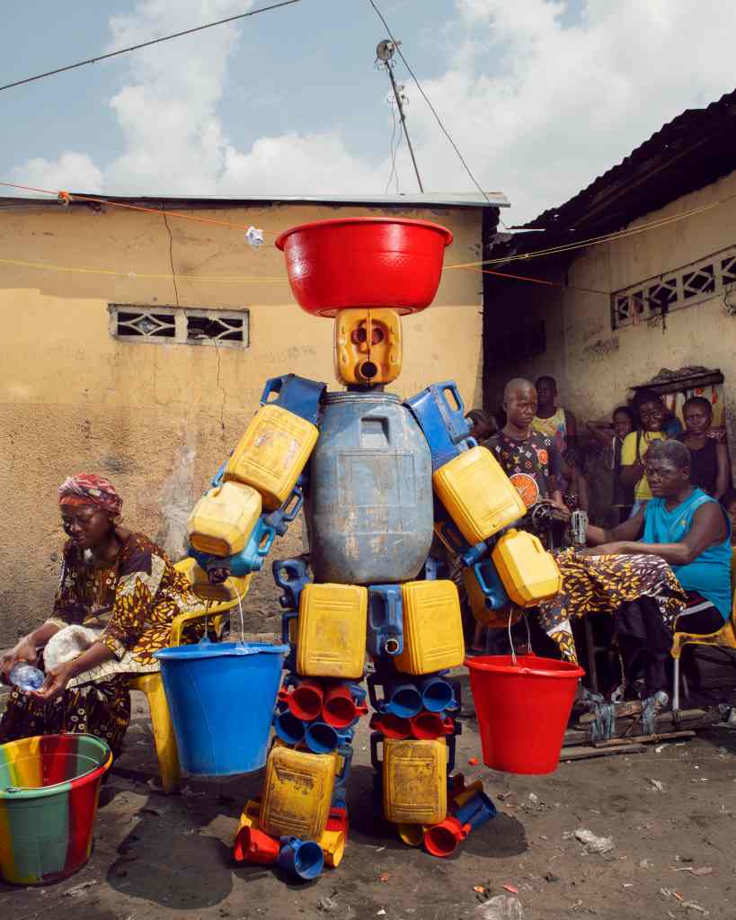 A person dressed in a costume made from plastic containers